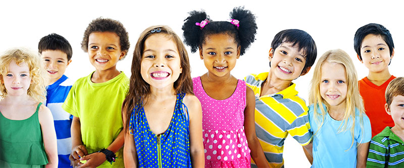 The image shows a group of children posing together with smiles on their faces.